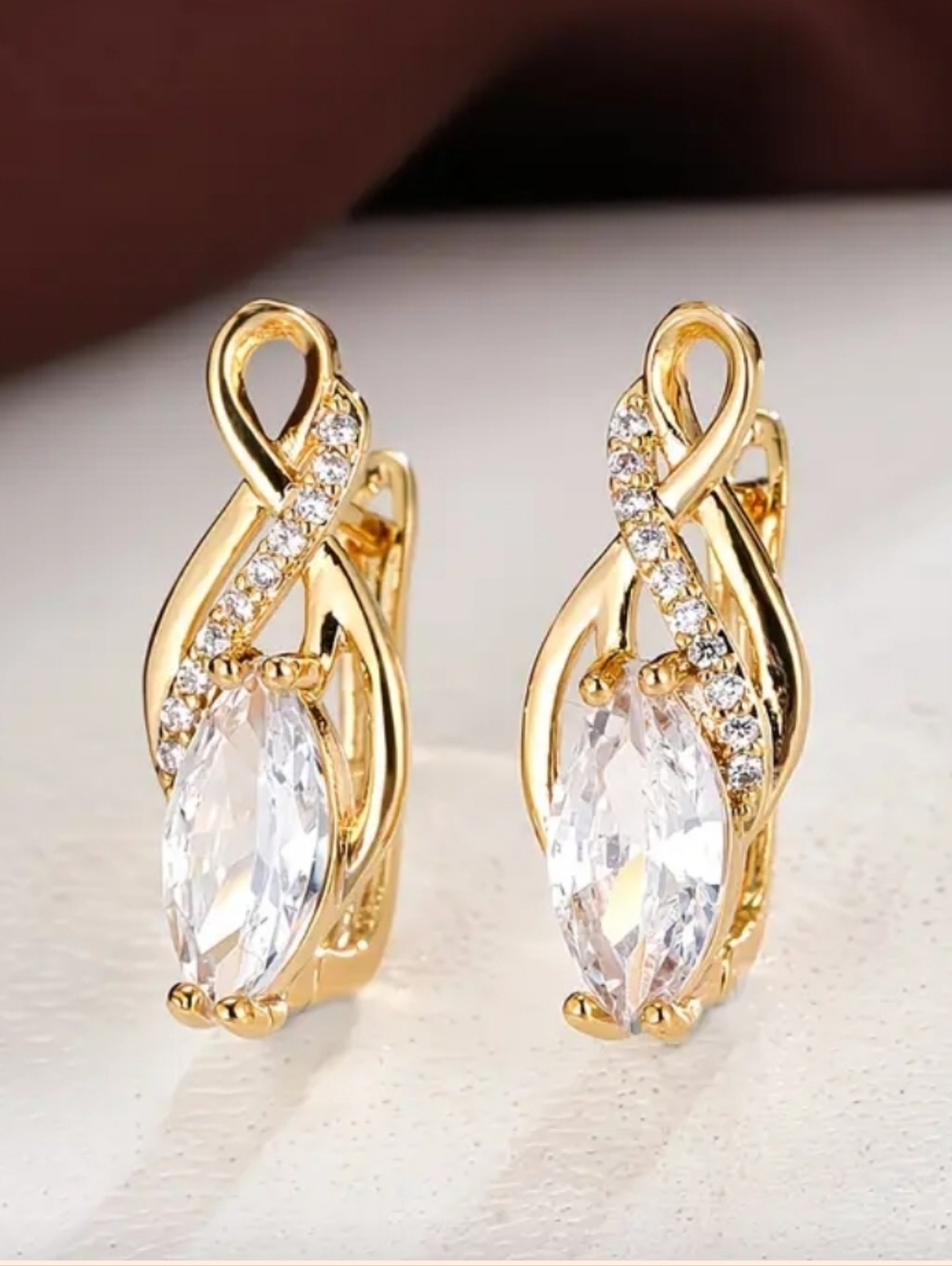 18k Gold Huggy Hoop Earrings.